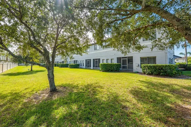a house with swimming pool in front of it