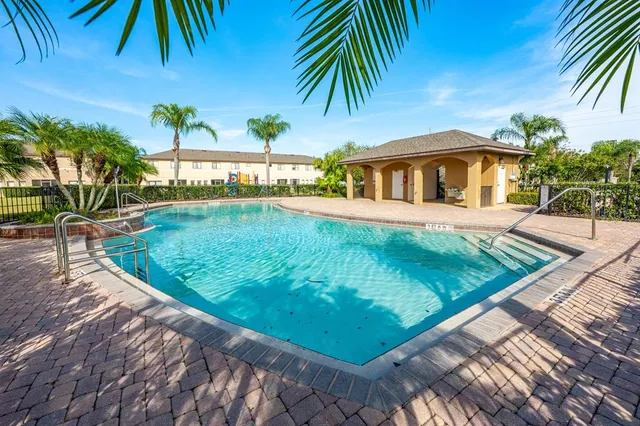 a view of a swimming pool and a yard