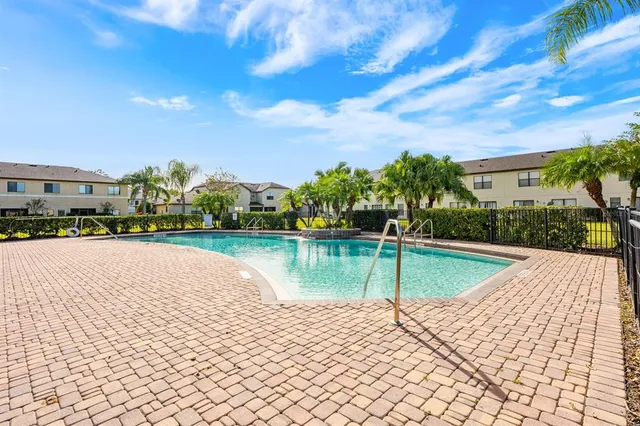 a view of a swimming pool with a terrace