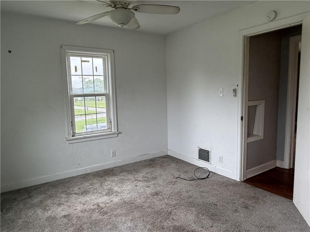 1146 Franklin Road Jackson Center, PA 16133 - Photo 12 of 19 an empty room with windows and closet