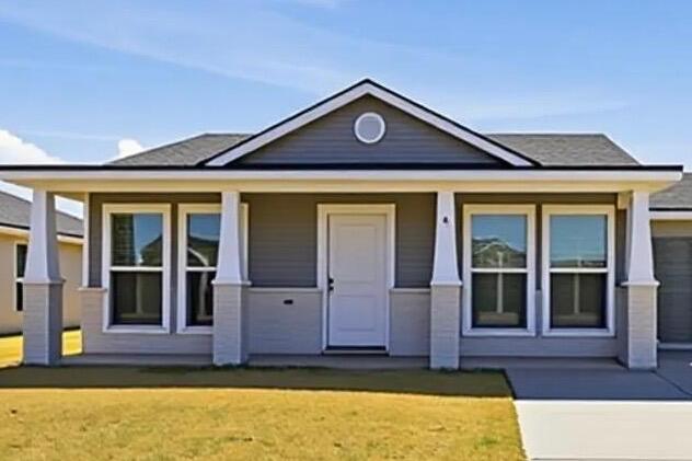 front view of a house with a yard