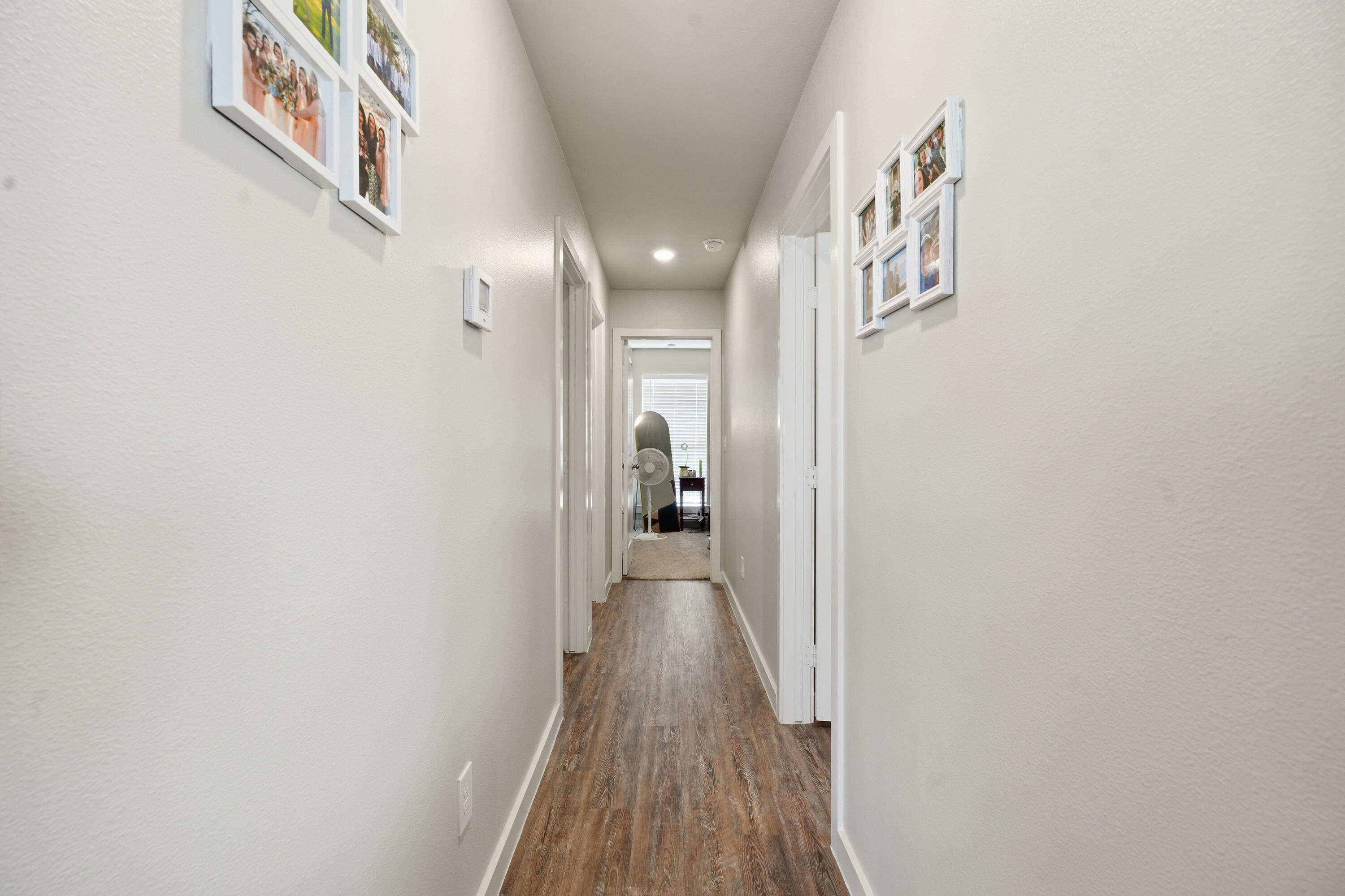 1605 135th Street Lubbock, TX 79423 - Photo 11 of 21 a view of hallway with wooden floor