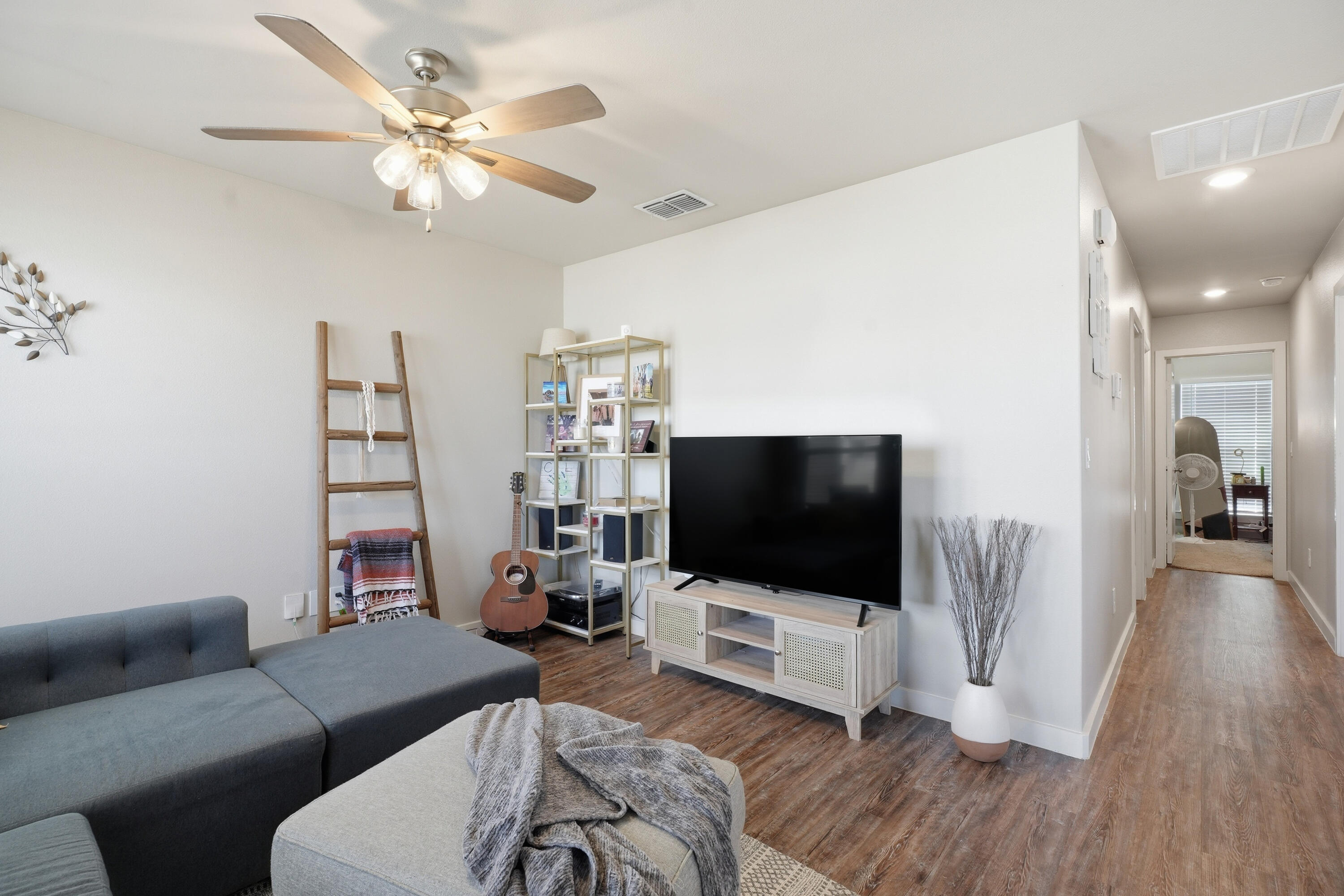 1605 135th Street Lubbock, TX 79423 - Photo 3 of 21 a living room with furniture and a flat screen tv