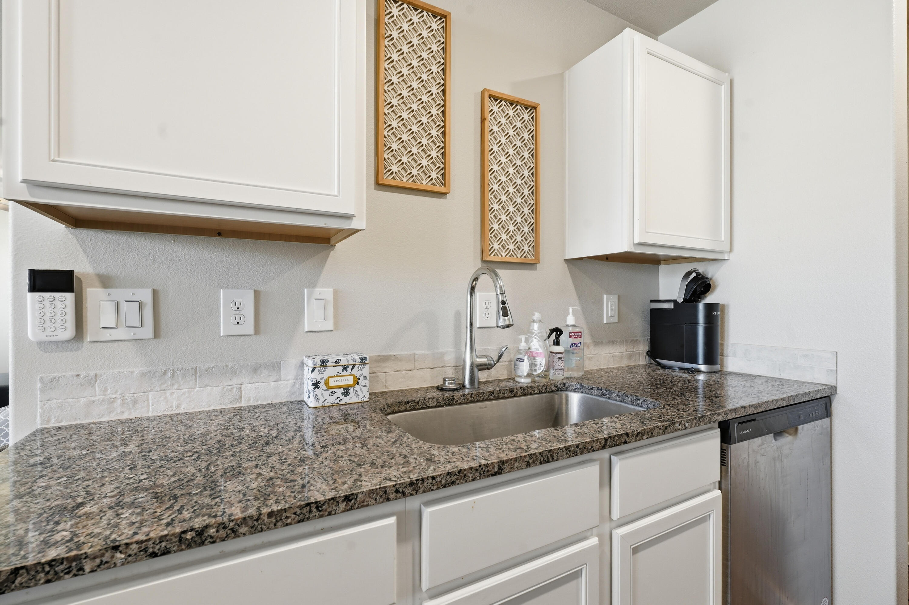 1605 135th Street Lubbock, TX 79423 - Photo 8 of 21 a kitchen with sink cabinets and granite counter top