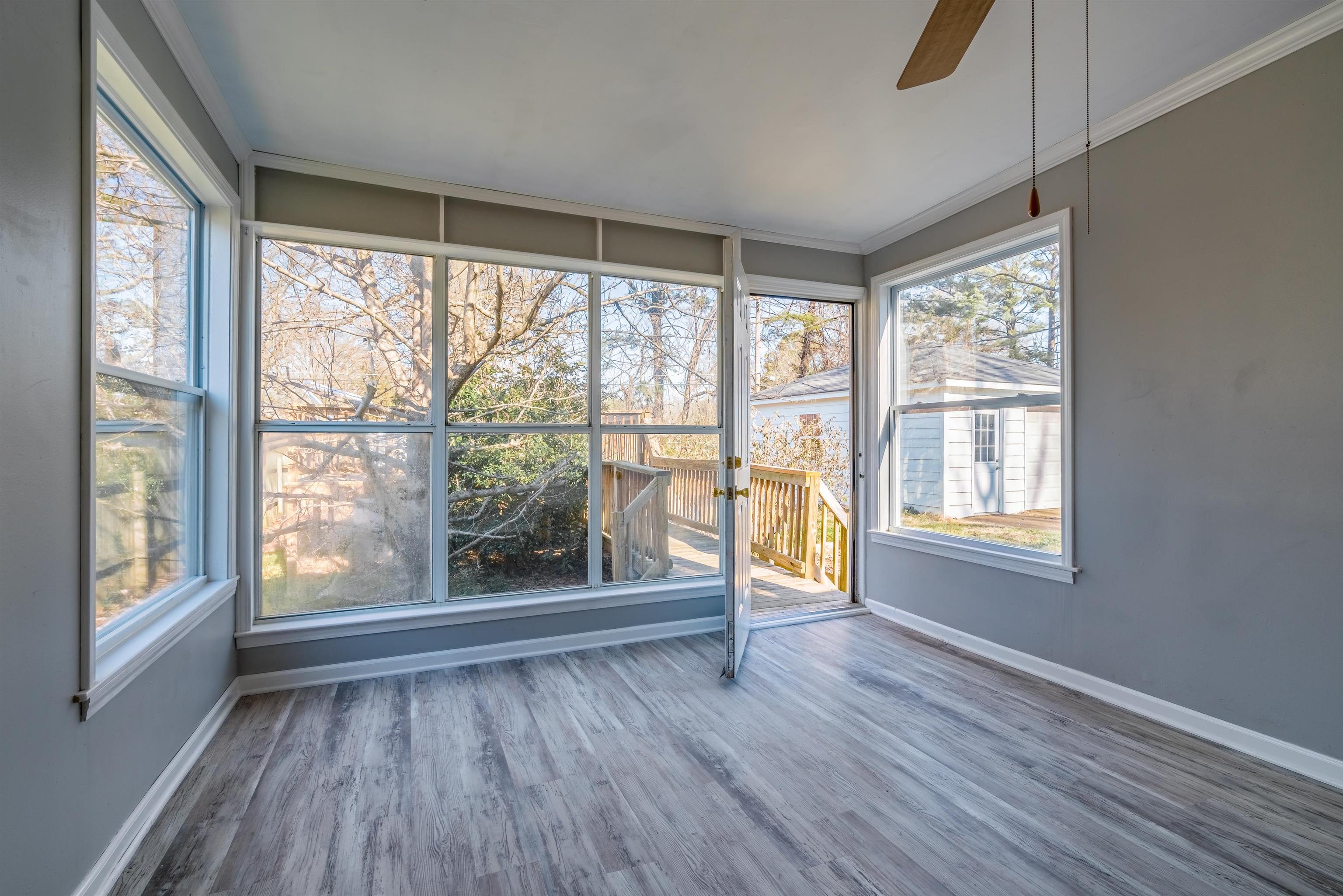 4430 Boyce Road Memphis, TN 38117 - Photo 16 of 25 a view of an empty room with wooden floor and a window