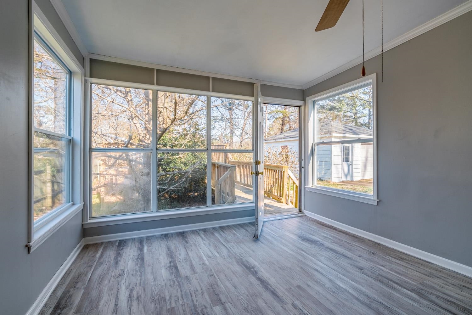 4430 Boyce Road Memphis, TN 38117 - Photo 17 of 25 a view of an empty room with wooden floor and a window