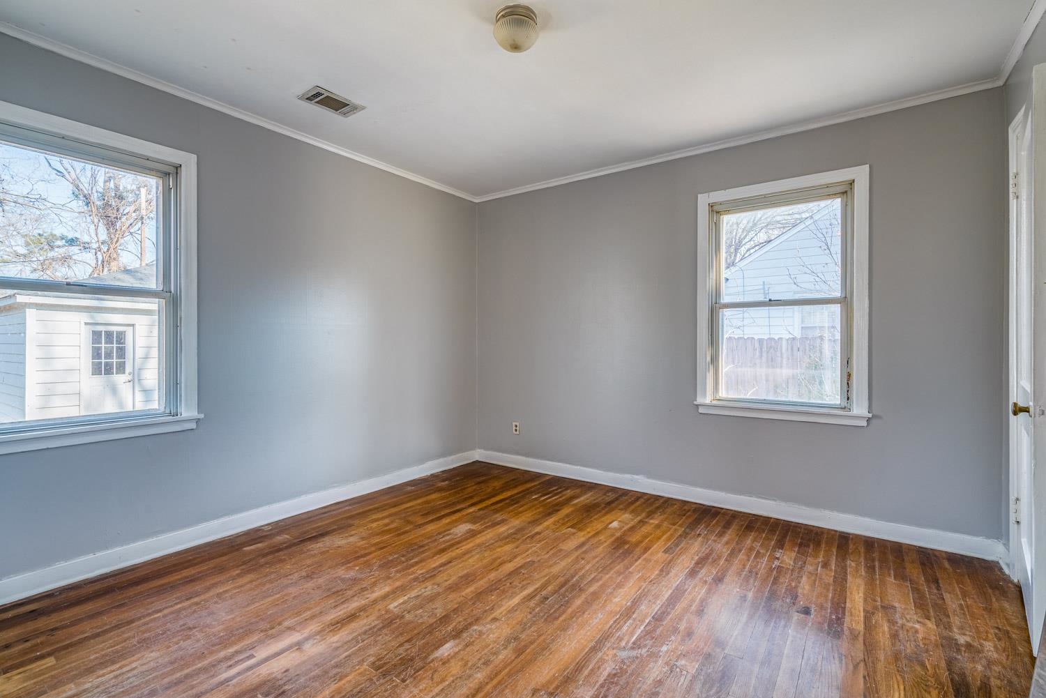 4430 Boyce Road Memphis, TN 38117 - Photo 19 of 25 a view of empty room with wooden floor and fan