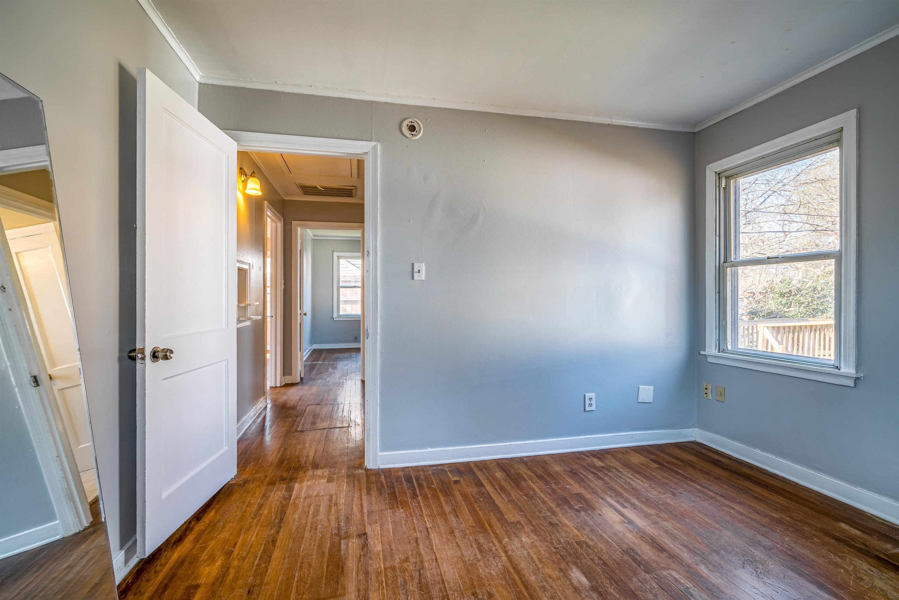 4430 Boyce Road Memphis, TN 38117 - Photo 20 of 25 wooden floor in an empty room with a window
