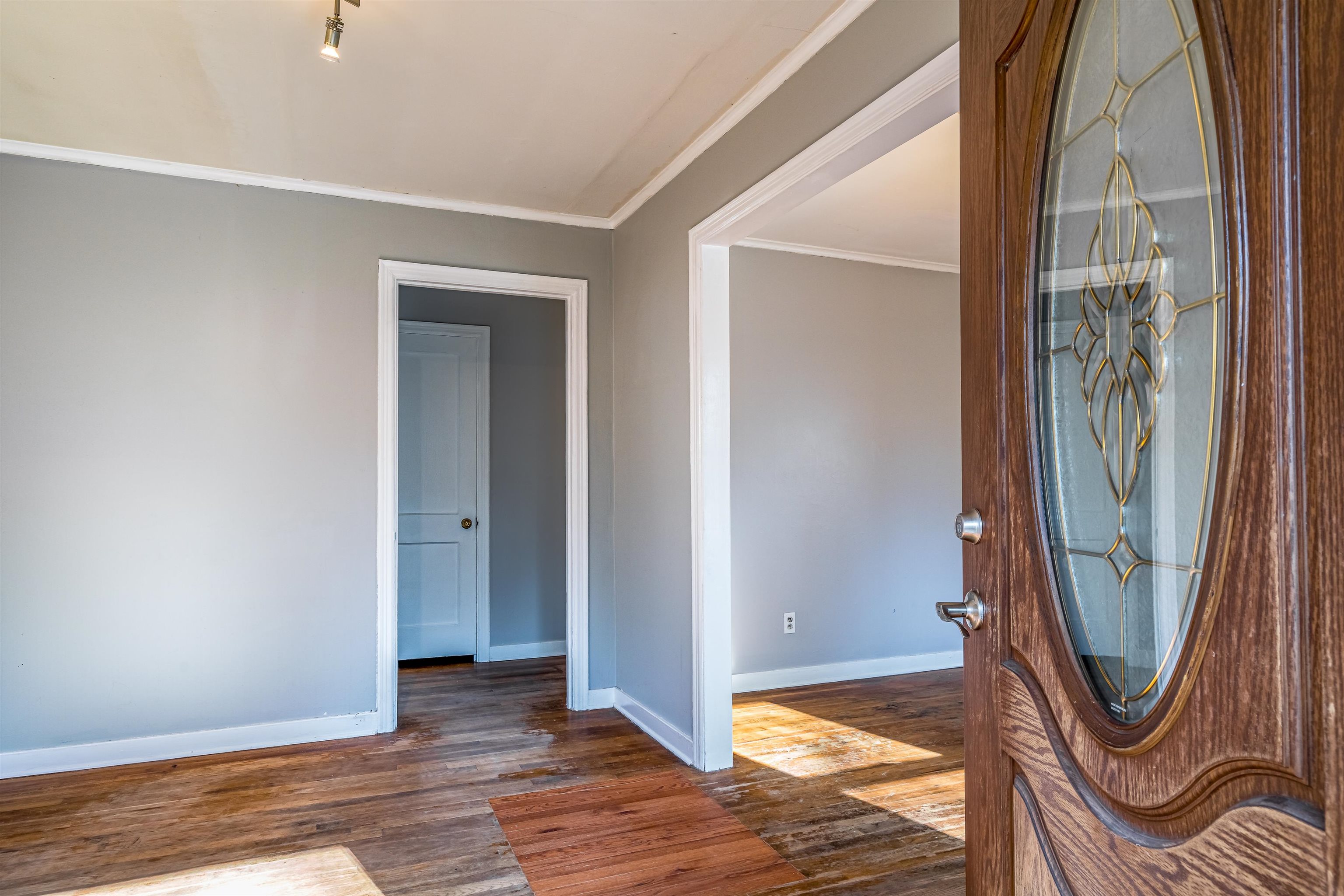 4430 Boyce Road Memphis, TN 38117 - Photo 4 of 25 a view of empty room with wooden floor and fan