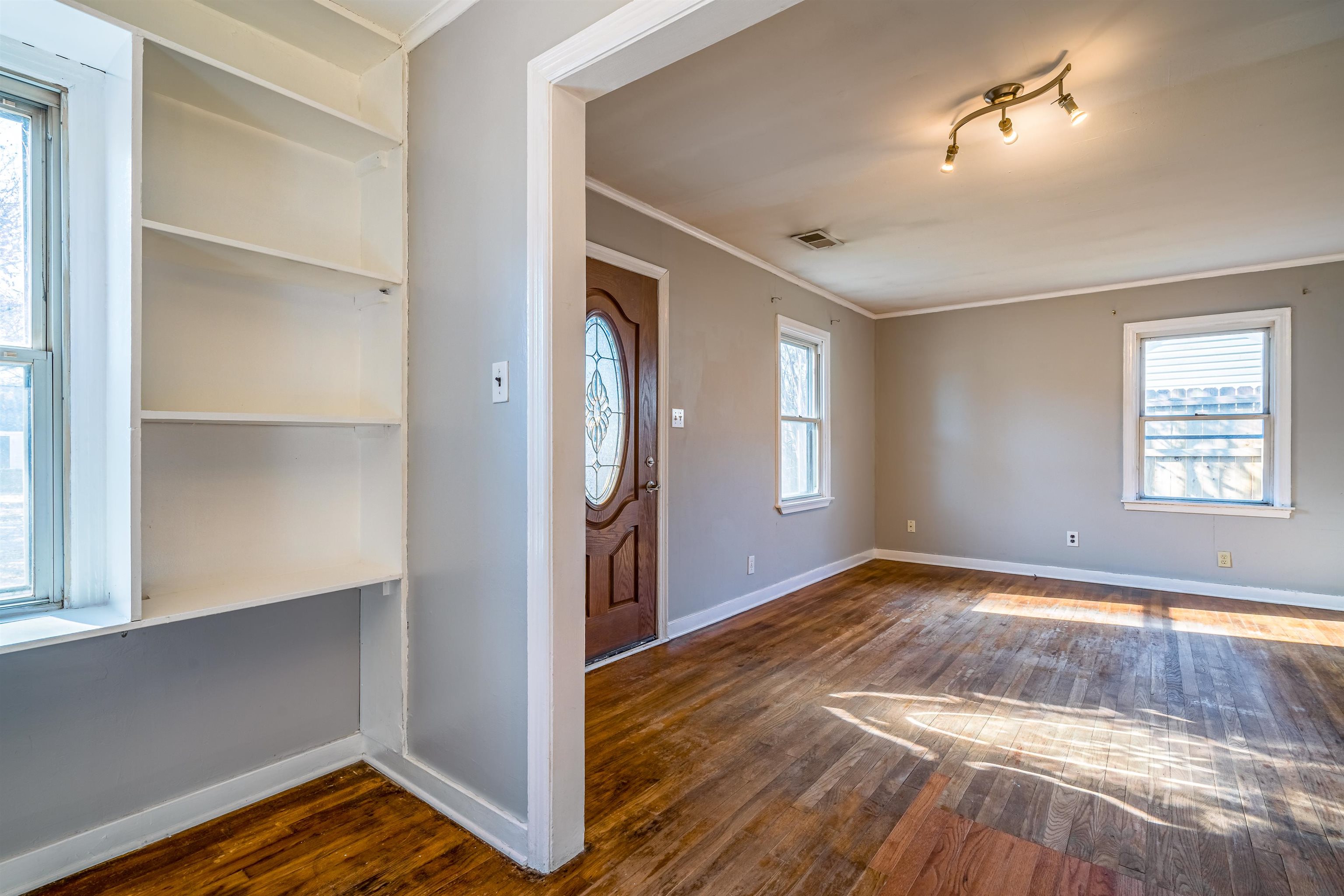 4430 Boyce Road Memphis, TN 38117 - Photo 9 of 25 a view of empty room with wooden floor and fan