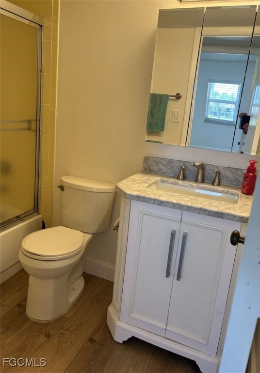 180 Turtle Lake Court, Unit 101 Naples, FL 34105 - Photo 11 of 14 a bathroom with a sink and a mirror