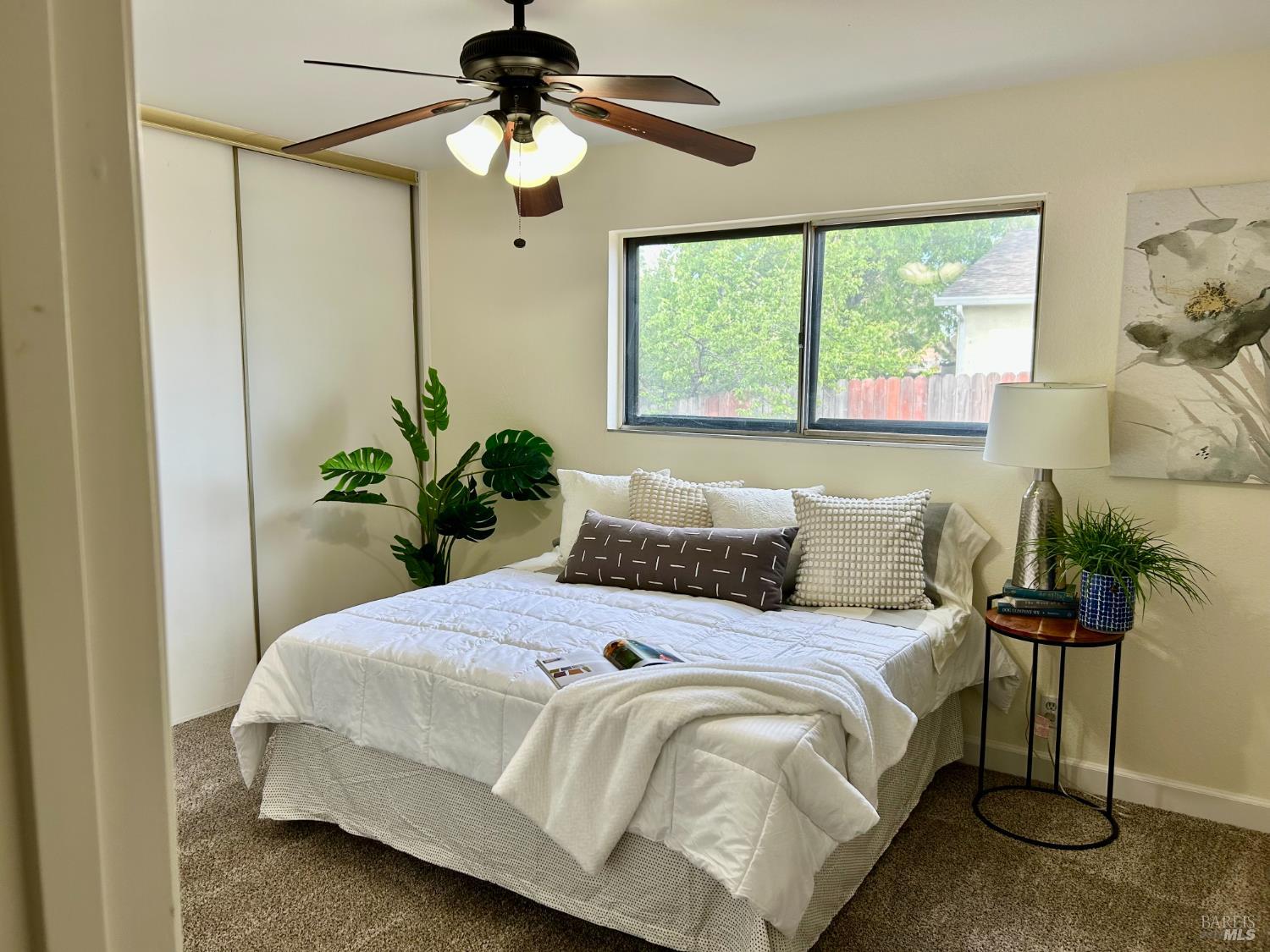 1312 Sutter Court Fairfield, CA 94533 - Photo 11 of 45 a bedroom with a bed and a chandelier