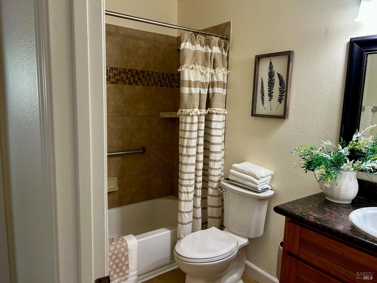 1312 Sutter Court Fairfield, CA 94533 - Photo 15 of 45 a bathroom with a sink toilet and shower