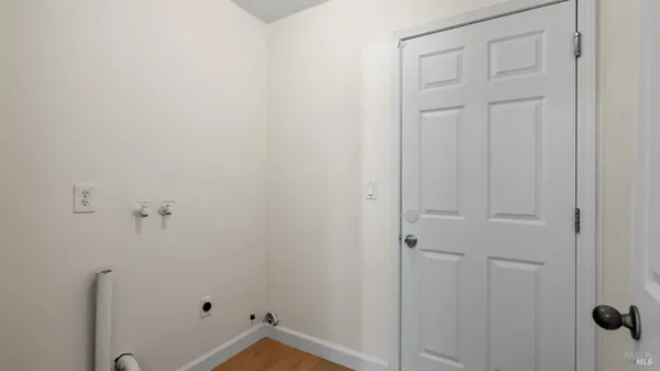 a bedroom with a bed table and a couch
