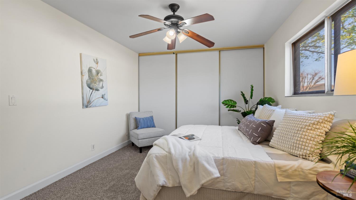 1312 Sutter Court Fairfield, CA 94533 - Photo 36 of 45 a bedroom with a bed and a chandelier