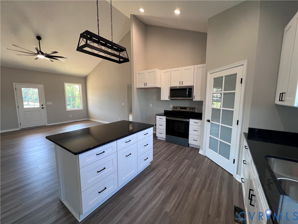 2905 Worsham Road Farmville, VA 23901 - Photo 9 of 23 Vaulted ceilings with a decorative chandelier, woo