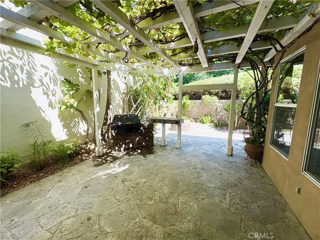 a view of yard with patio