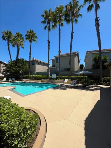 a view of a swimming pool with a yard