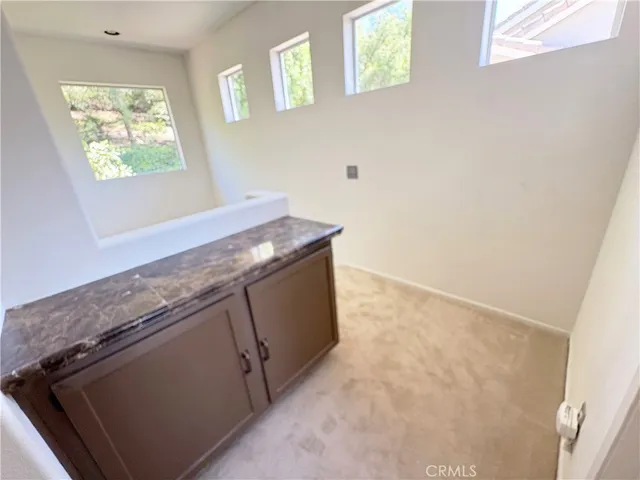 a view of kitchen island with wooden floor