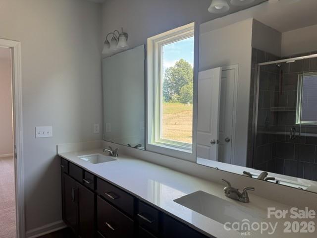 204 Rodeo Drive Shelby, NC 28150 - Photo 11 of 16 a bathroom with a sink double vanity and a mirror