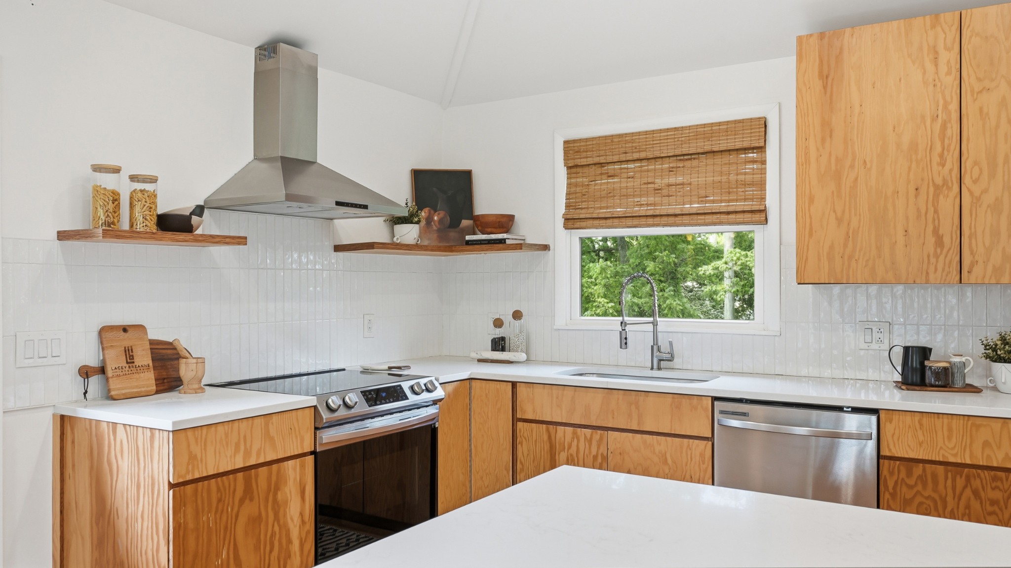 2101 Porter Road Nashville, TN 37216 - Photo 16 of 48 a kitchen with a sink a stove and cabinets