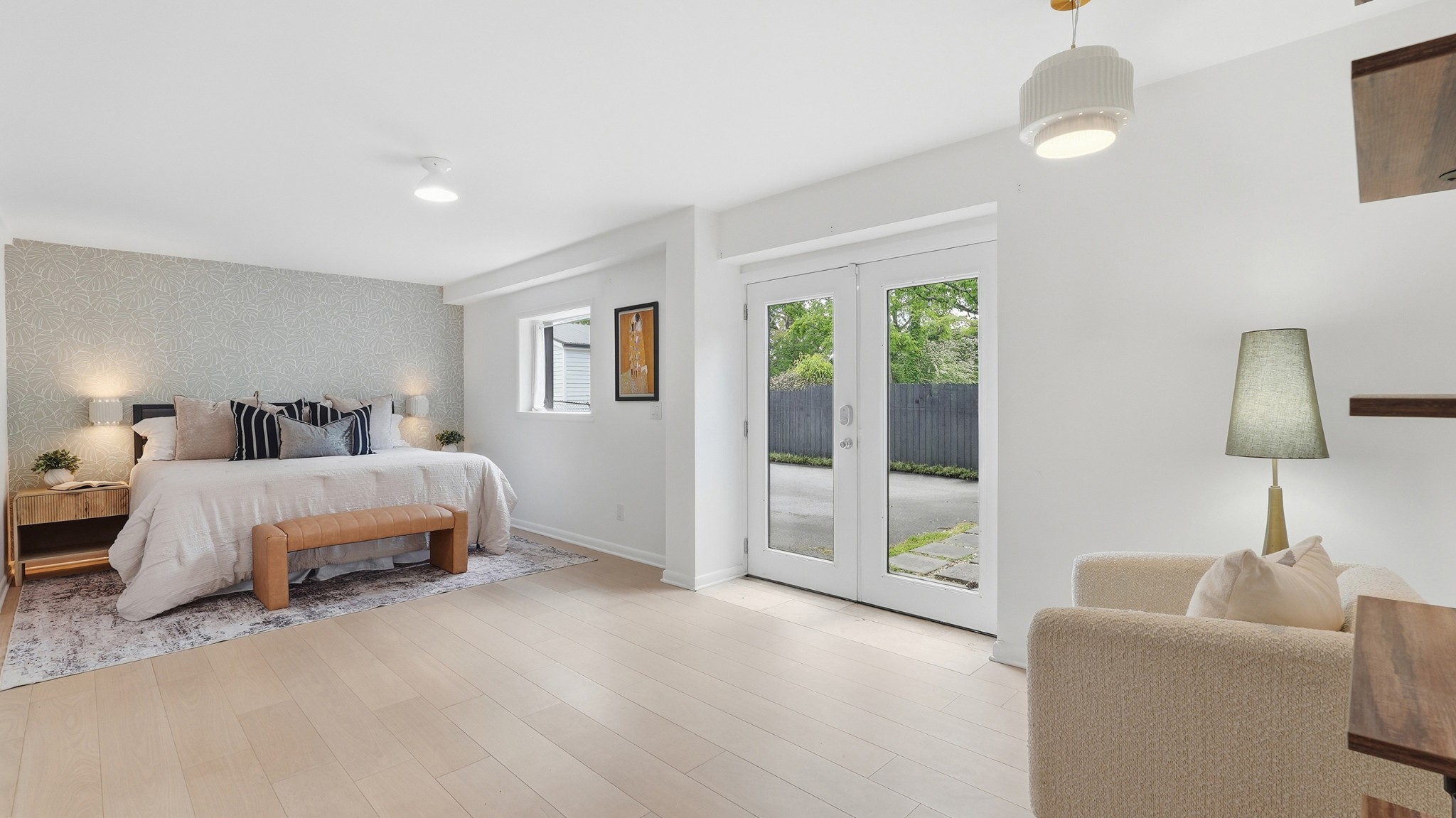 2101 Porter Road Nashville, TN 37216 - Photo 18 of 48 a spacious bedroom with a bed and a chandelier