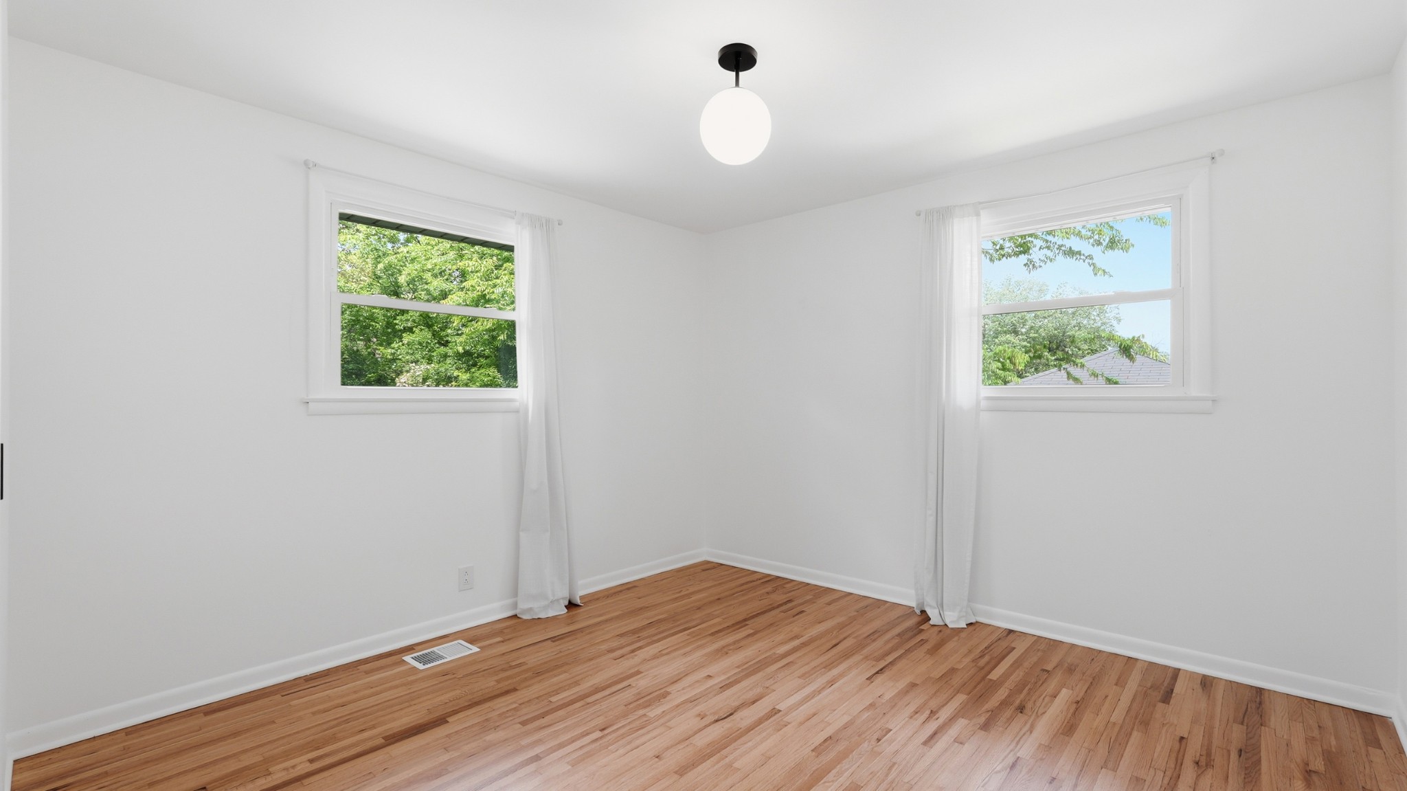 2101 Porter Road Nashville, TN 37216 - Photo 27 of 48 wooden floor in an empty room with a window