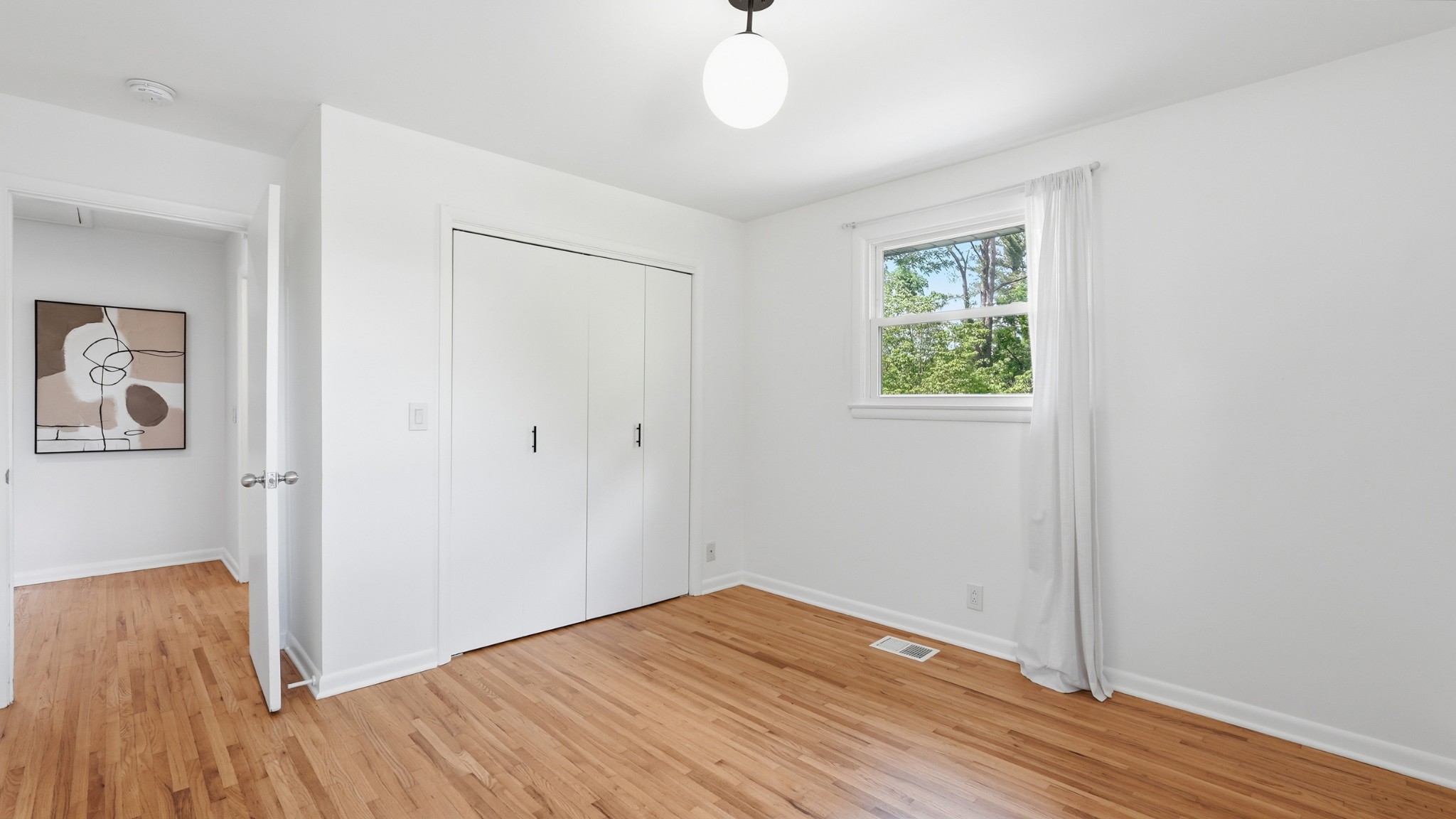 2101 Porter Road Nashville, TN 37216 - Photo 28 of 48 wooden floor in an empty room with a window