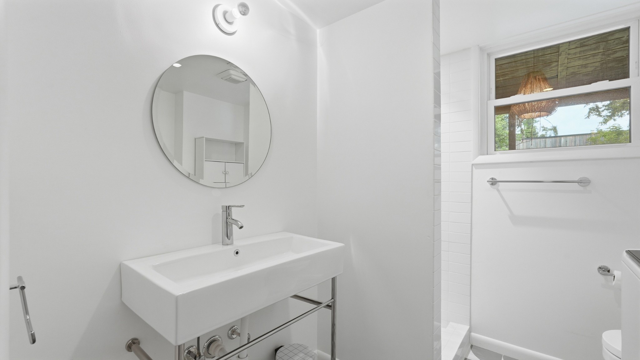 2101 Porter Road Nashville, TN 37216 - Photo 34 of 48 a bathroom with a sink a toilet and a mirror