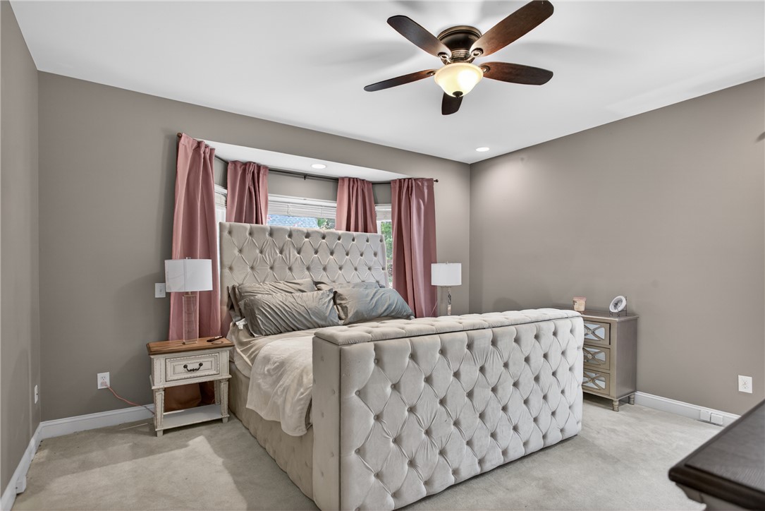 136 Loran Pointe Circle Seneca, SC 29672 - Photo 17 of 50 Plush carpeting and a soft color palette create a restful primary bedroom retreat.