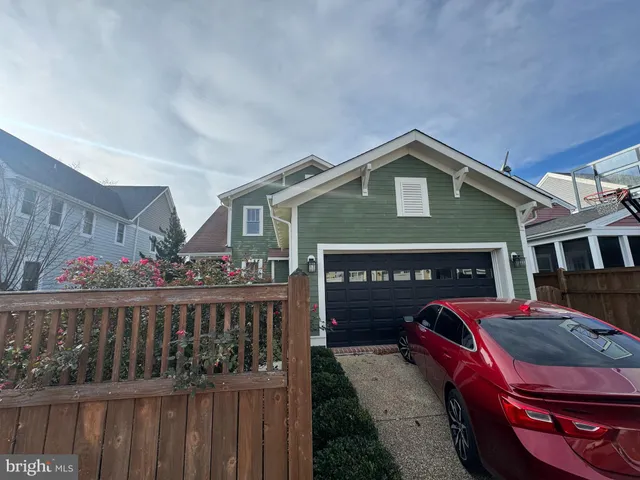 a front view of house with deck and outdoor seating