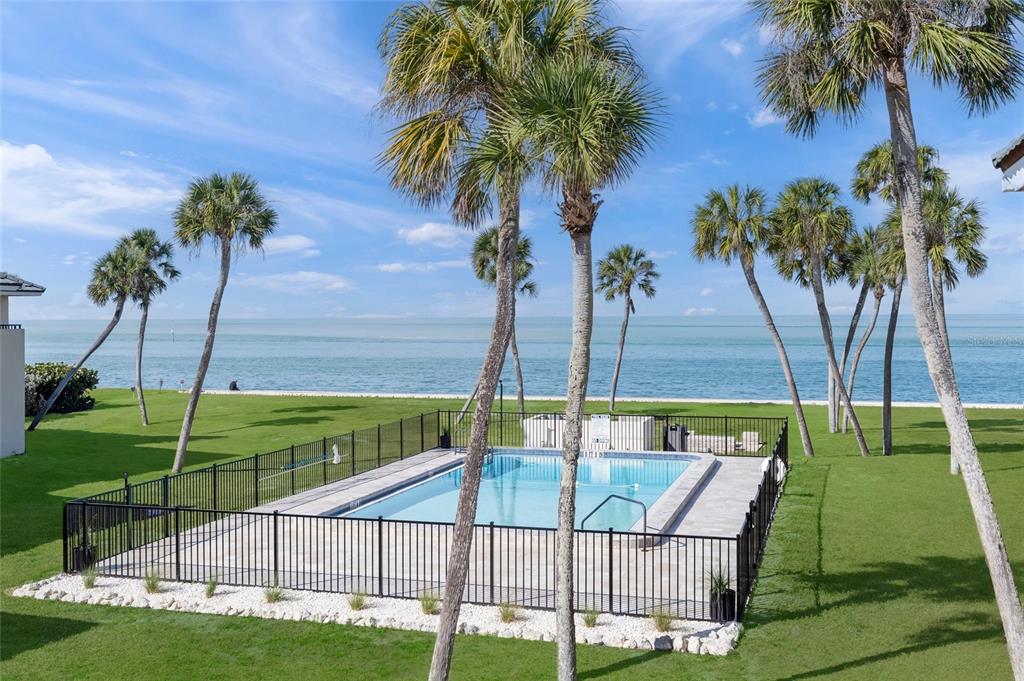 4660 Ocean Boulevard, Unit O2 Sarasota, FL 34242 - Photo 28 of 55 a view of an outdoor space and swimming pool