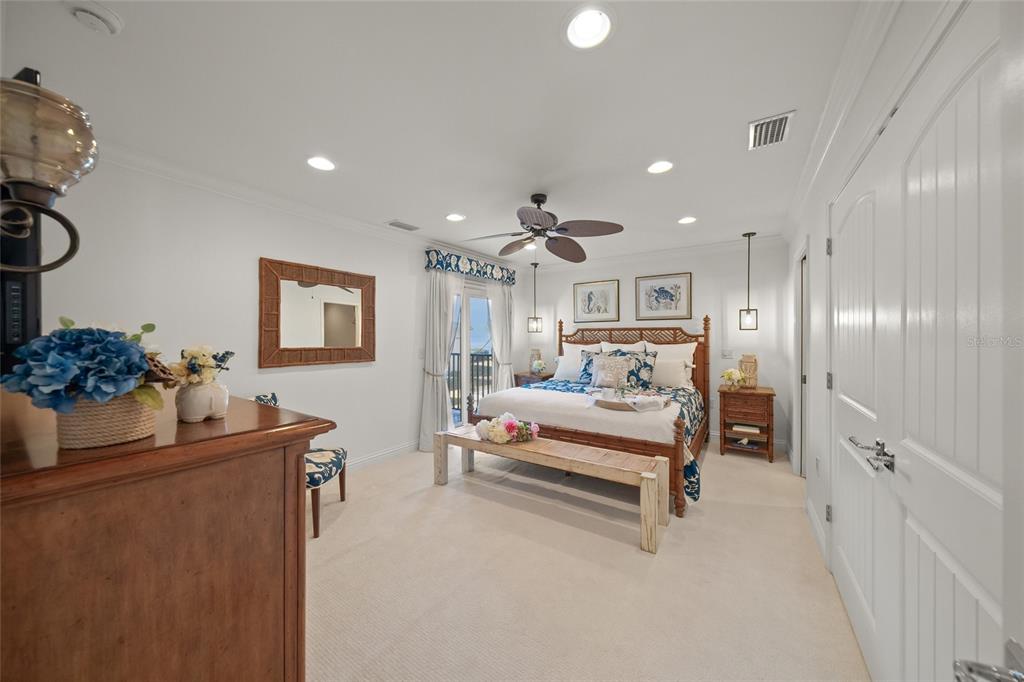 4660 Ocean Boulevard, Unit O2 Sarasota, FL 34242 - Photo 32 of 55 a living room with furniture and a chandelier