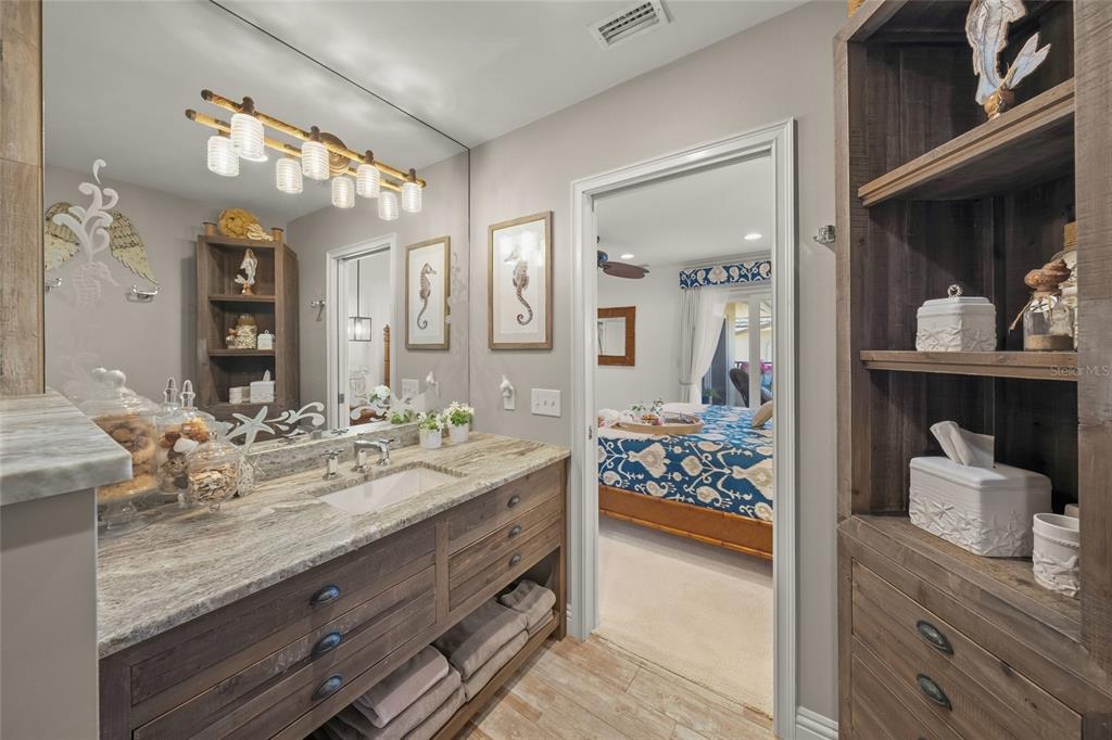 4660 Ocean Boulevard, Unit O2 Sarasota, FL 34242 - Photo 33 of 55 a bathroom with a sink double vanity and a mirror