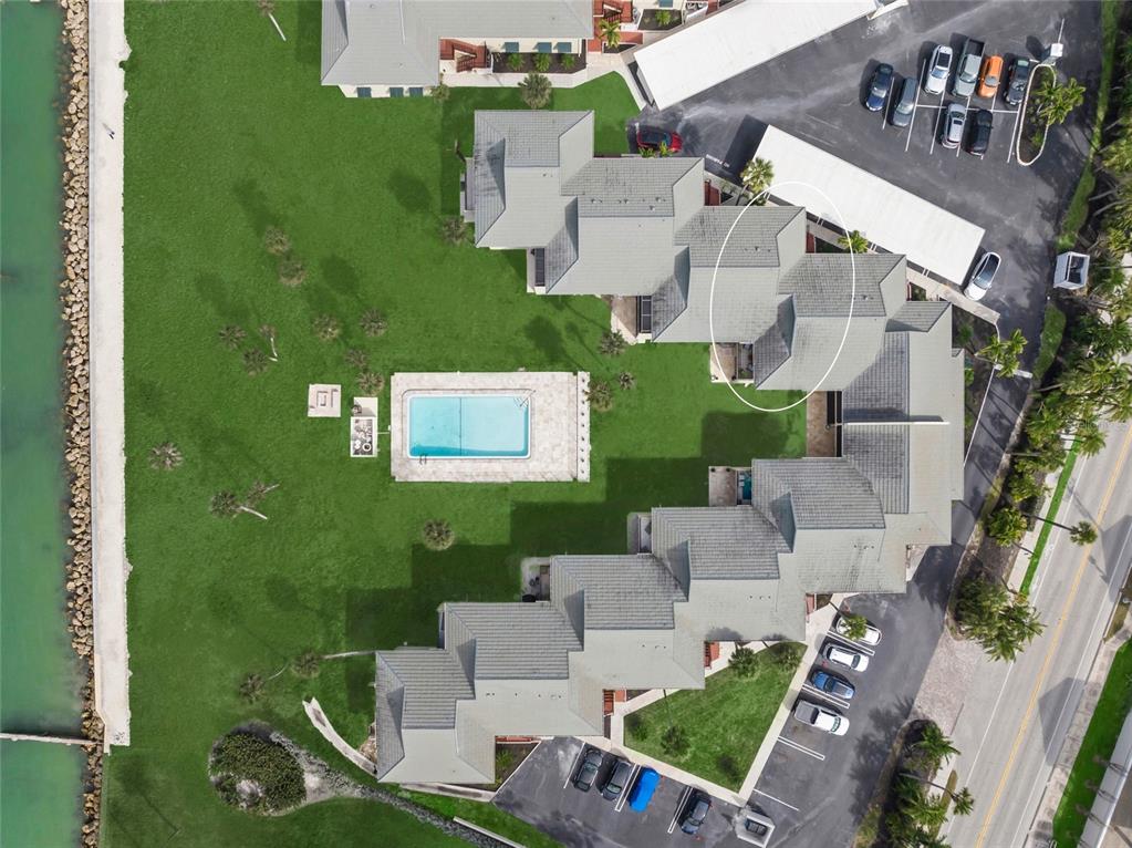 4660 Ocean Boulevard, Unit O2 Sarasota, FL 34242 - Photo 46 of 55 an aerial view of a house with swimming pool and outdoor seating