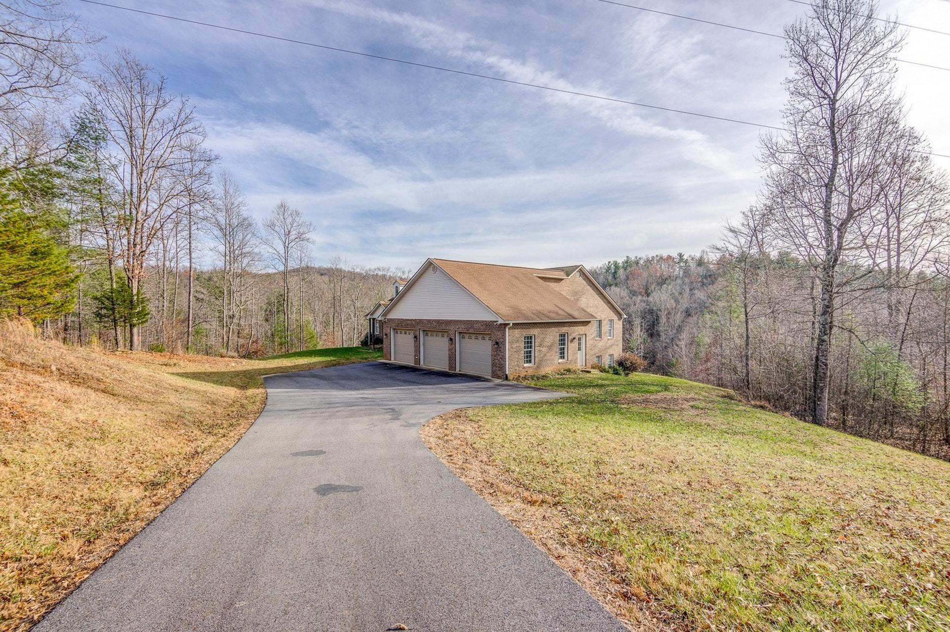 2774 Republican Church Road Ferrum, VA 24088 - Photo 15 of 52 a view of a big house with a big yard and large tree