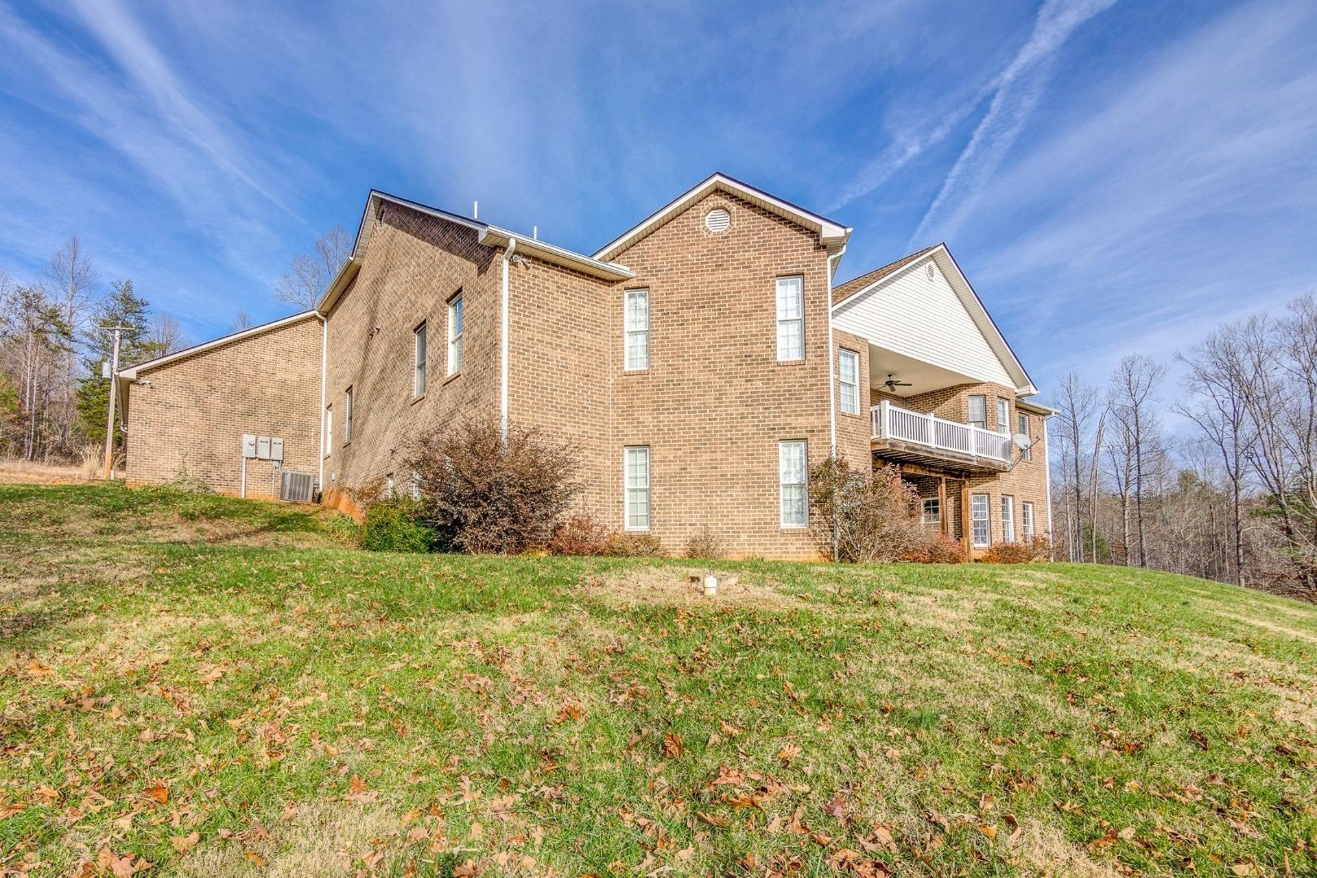 2774 Republican Church Road Ferrum, VA 24088 - Photo 20 of 52 a front view of a house with a yard
