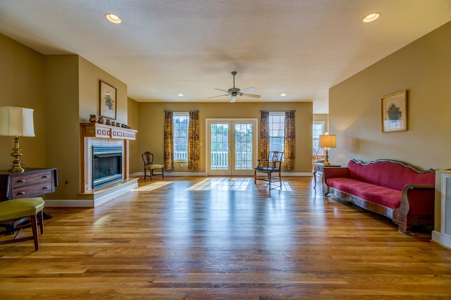 2774 Republican Church Road Ferrum, VA 24088 - Photo 3 of 52 a living room with fireplace furniture and a wooden floor