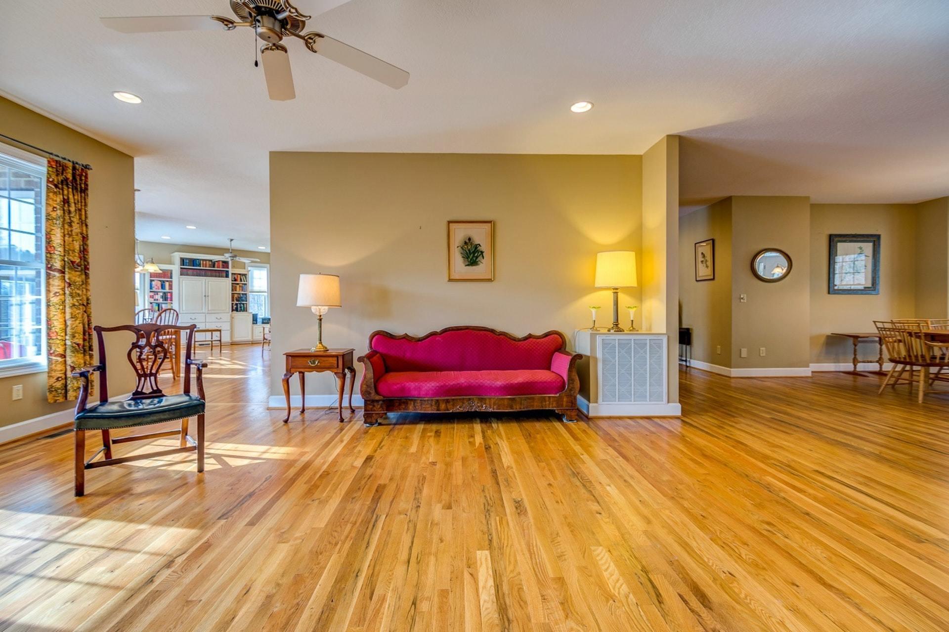 2774 Republican Church Road Ferrum, VA 24088 - Photo 26 of 52 a spacious bedroom with a bed and wooden floor