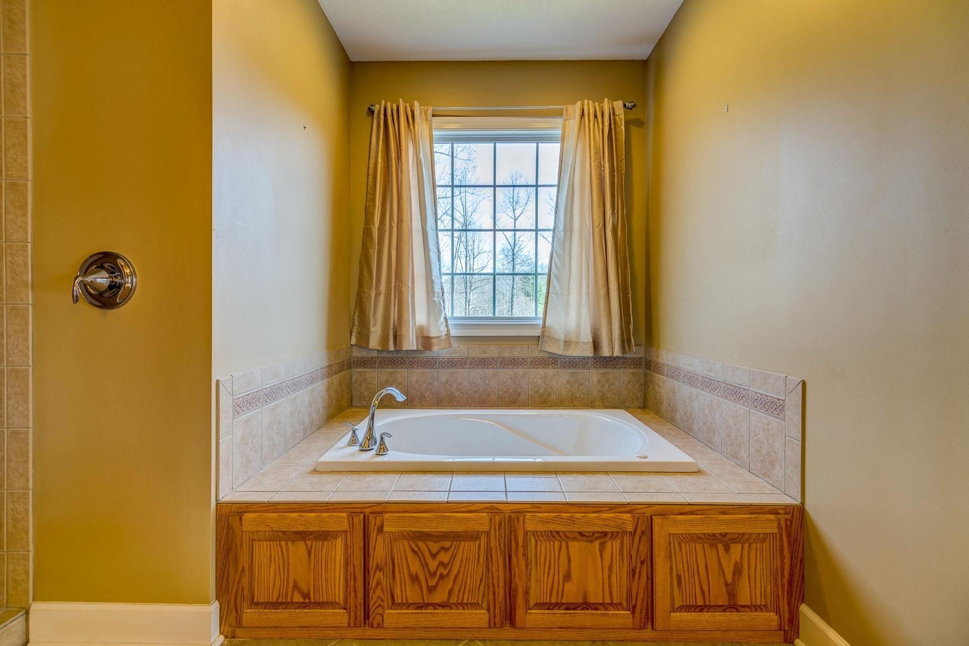 2774 Republican Church Road Ferrum, VA 24088 - Photo 35 of 52 a bathroom with a granite countertop sink and a mirror