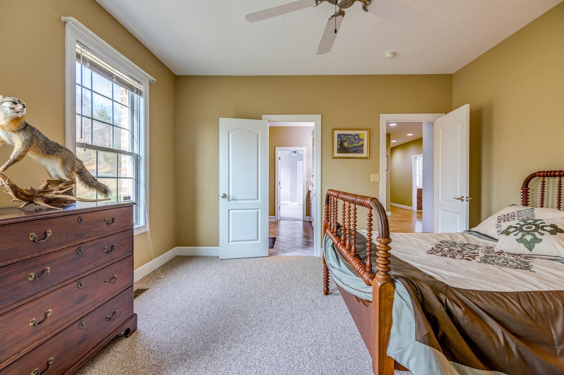 2774 Republican Church Road Ferrum, VA 24088 - Photo 36 of 52 a bedroom with a bed and wooden floor