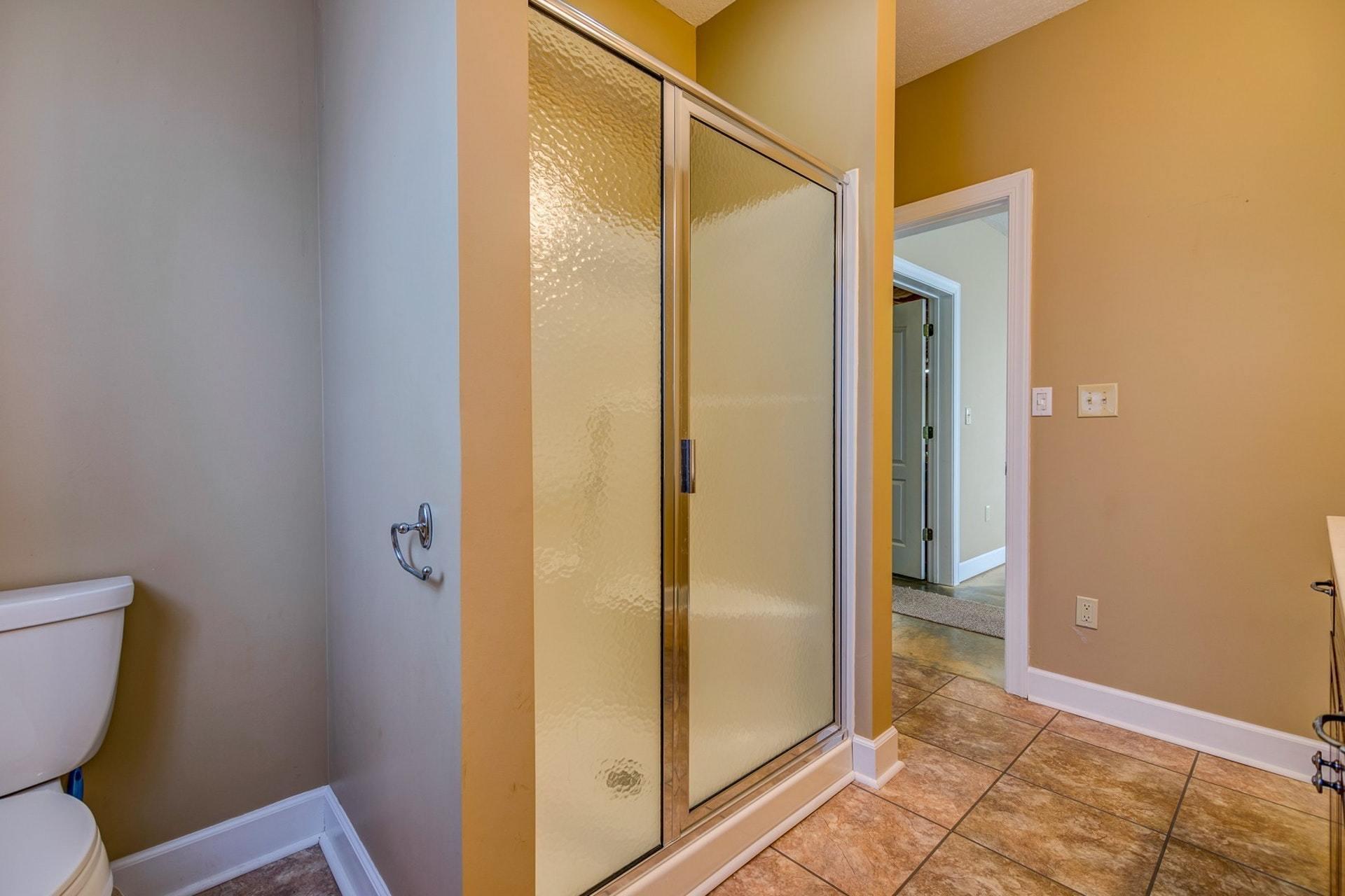 2774 Republican Church Road Ferrum, VA 24088 - Photo 43 of 52 a bathroom with a glass shower door