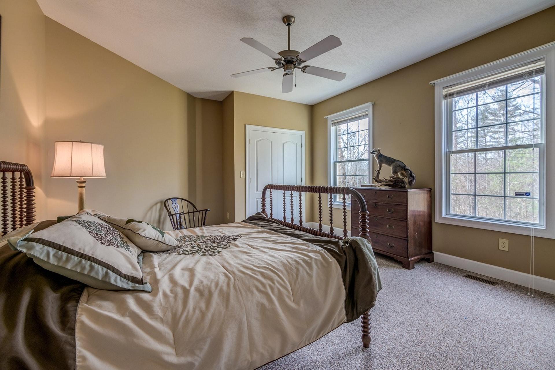 2774 Republican Church Road Ferrum, VA 24088 - Photo 10 of 52 a bed sitting in a bedroom next to a window