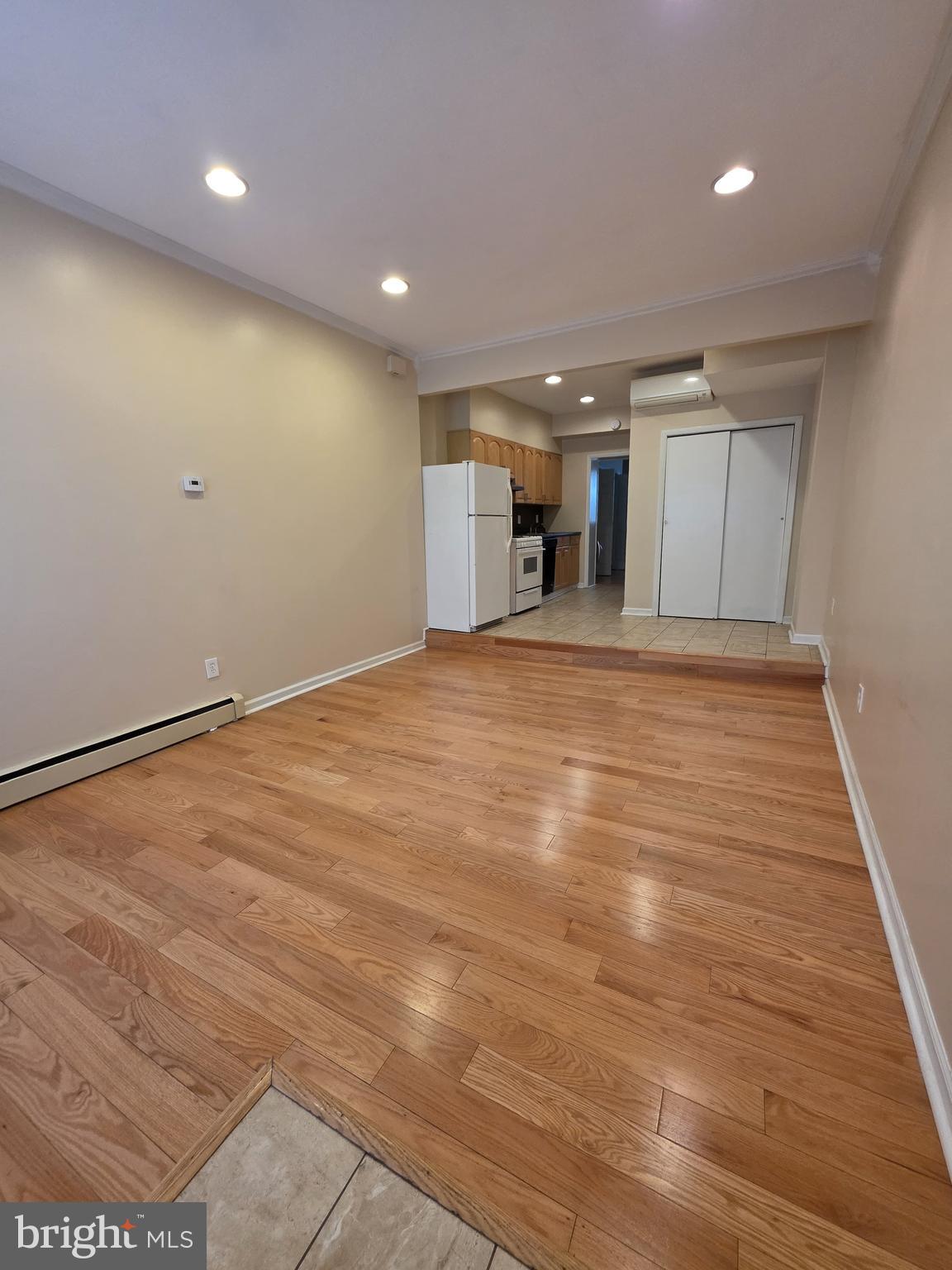 1153 South 11th Street, Unit A Philadelphia, PA 19147 - Photo 2 of 12 a view of empty room with wooden floor