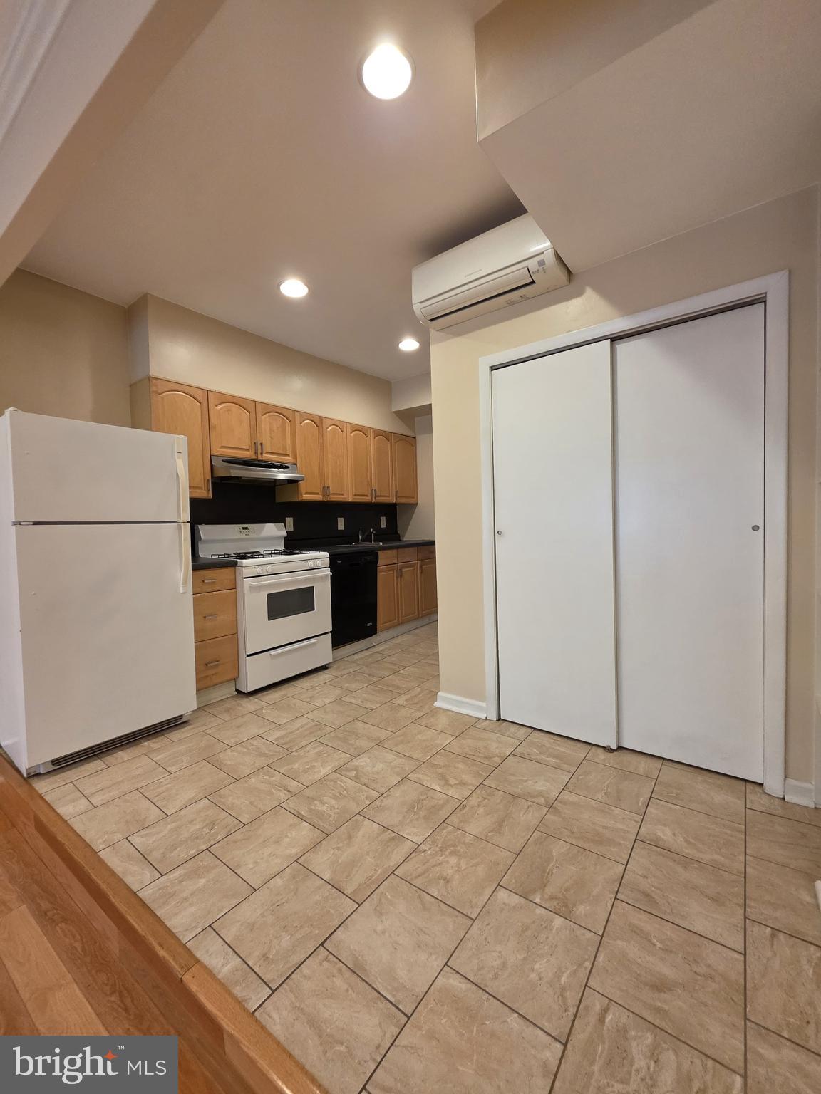 1153 South 11th Street, Unit A Philadelphia, PA 19147 - Photo 3 of 12 a view of kitchen with cabinets and refrigerator