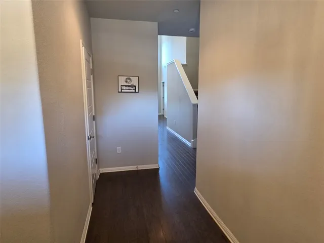 an empty room with wooden floor