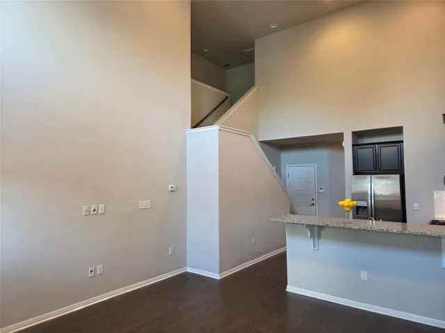 a view of a living room with a sink and a mirror
