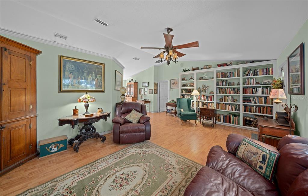 399 Northeast 155 Place Citra, FL 32113 - Photo 22 of 58 a living room with furniture ceiling fan and a window