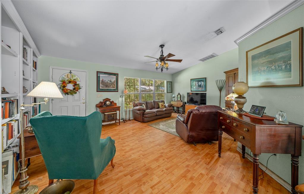 399 Northeast 155 Place Citra, FL 32113 - Photo 24 of 58 a living room with furniture and a window