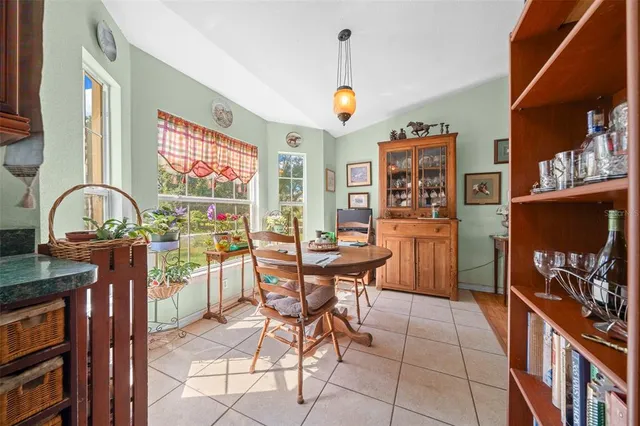 a bedroom with furniture and a large mirror